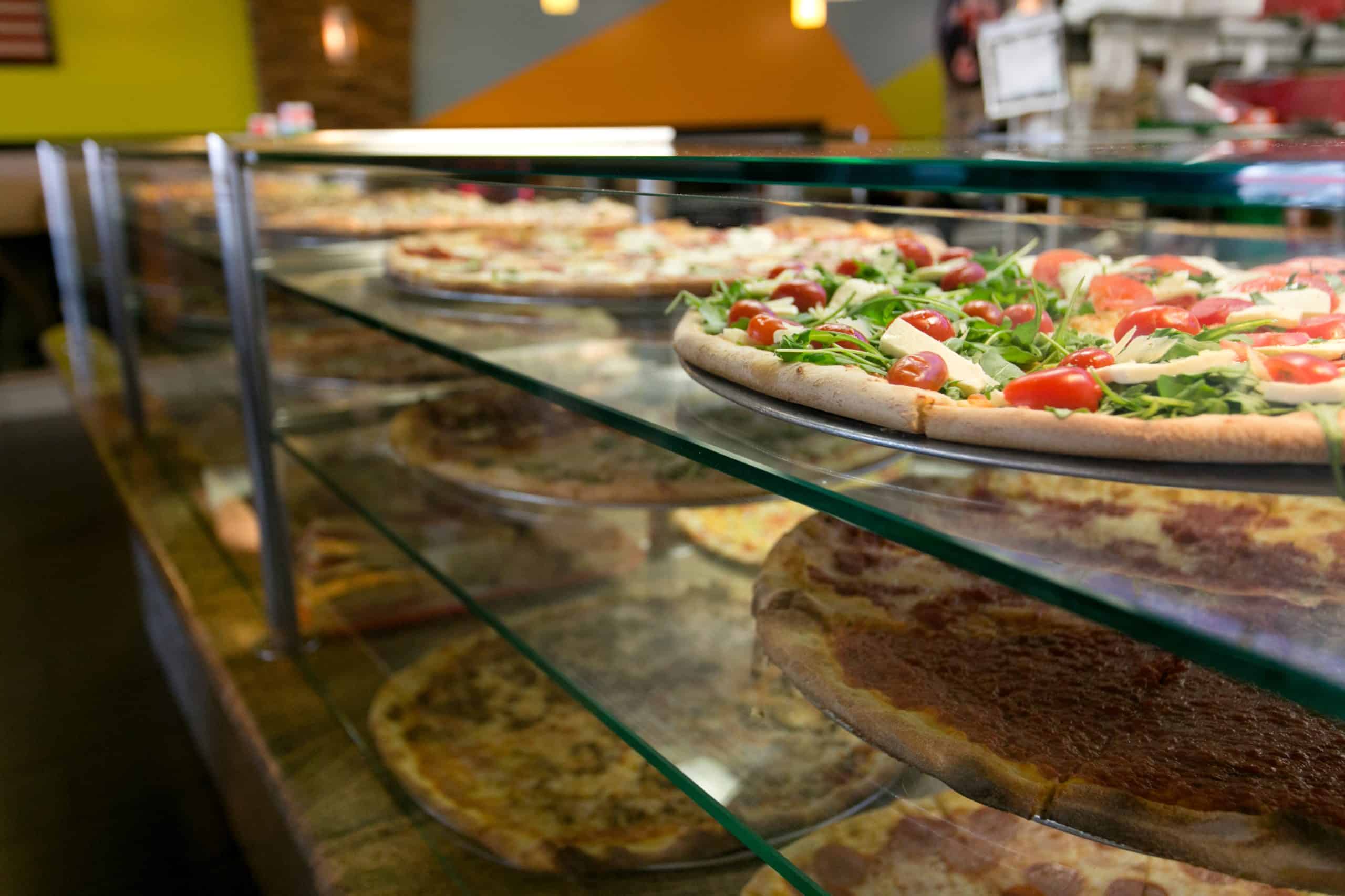 Fresh pizzas on display at Pizza Plaza of Warminster